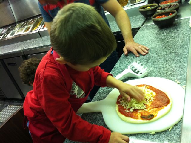 Ted making pizza at Fire and Stone
