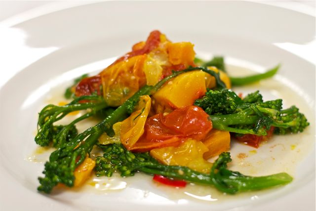 Roast squash and tomatoes with broccoli and garlic and chilli dressing
