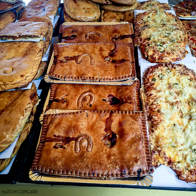 Barcelona street market stall selling horseshoe pastries