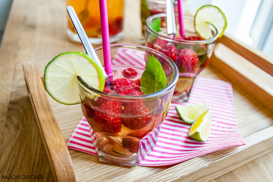 Quench your thirst this summer with this quick and easy refreshing cocktail mocktail idea - iced green tea fruit cup raspberry drink with lime and basil perfect for parties and barbecues
