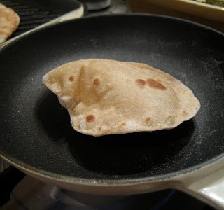 Coriander Chapatti puffing up in a hot pan