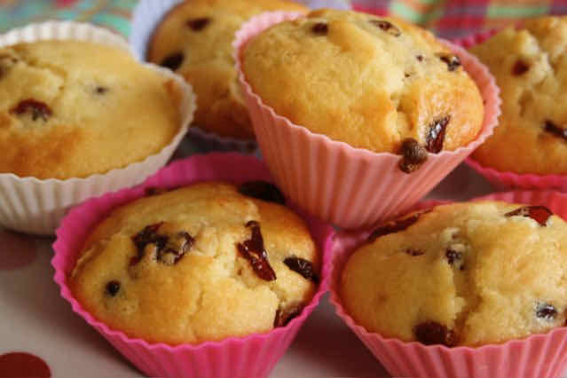 A pile of muffins in pink silicon cases