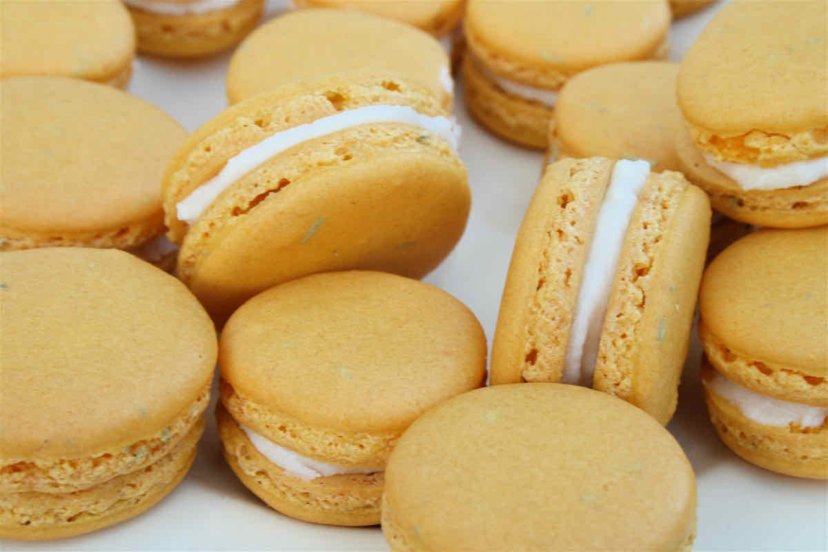 Lemon Macarons with Rosemary recipe - yellow macarons close up