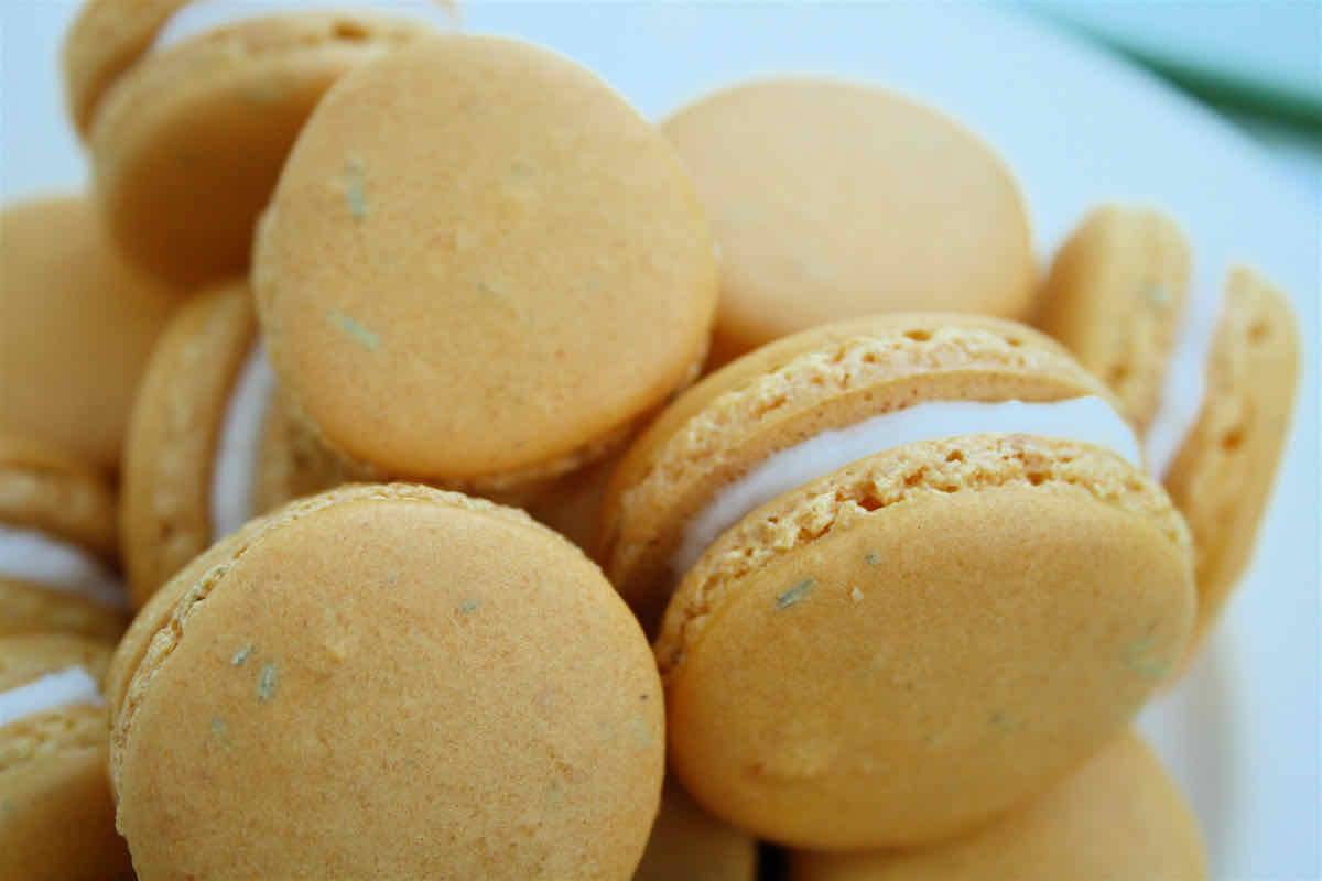 Lemon Macarons with Rosemary recipe - yellow macarons close up view