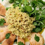 Lime and coriander hummus with triangles of pitta bread and lambs lettuce salad.