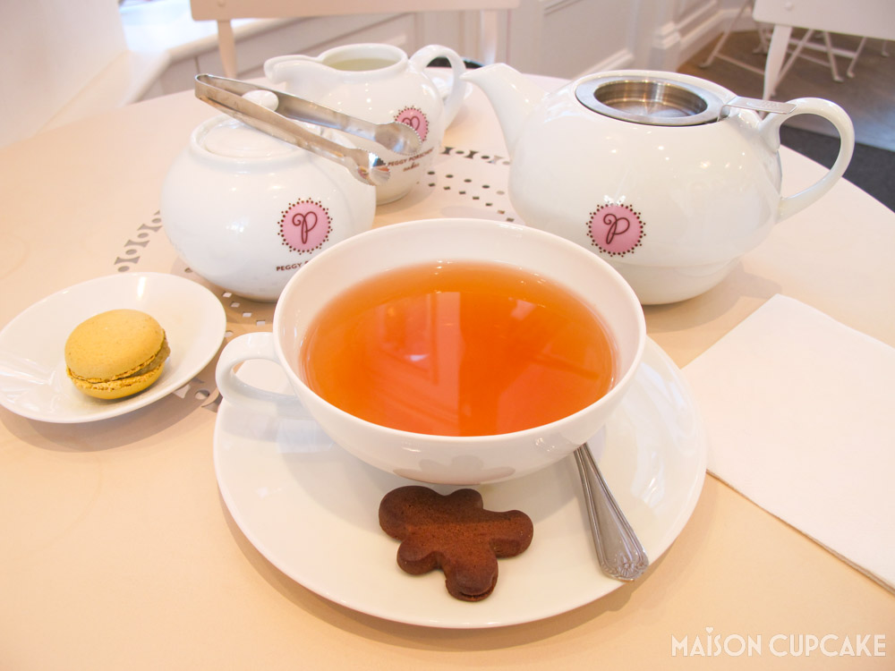 Tea Cup and Saucer With Gingerbread Man at Peggy Porschen Cafe London with branded teapot