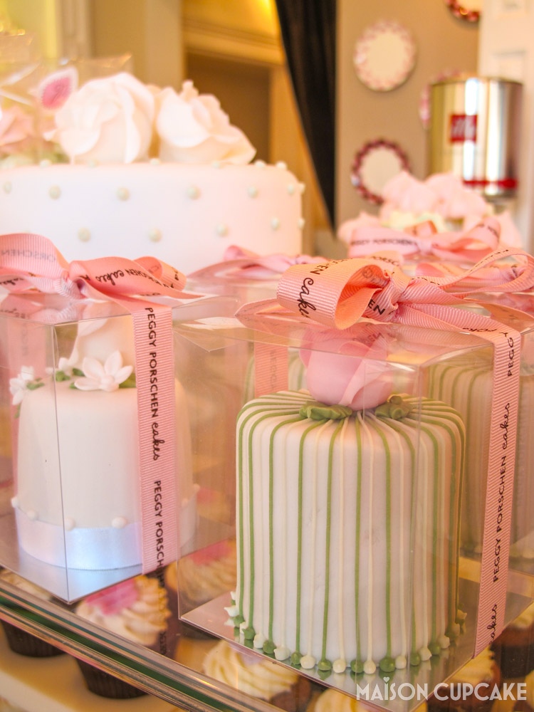 Boxed miniature cakes with candy stripe icing at Peggy Porschen London Cafe Pink Parlour