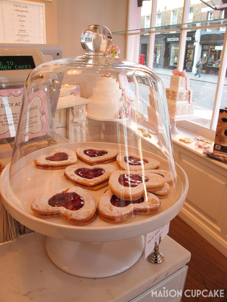 Peggy Porschen cafe London jammy dodger biscuits under glass dome