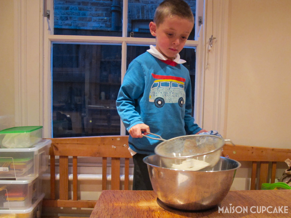 Pumpkin Whoopie Pies - steps - Ted helps sieve flour