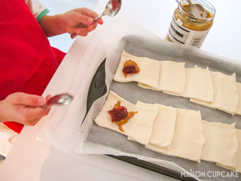 Peanut Butter Jelly Parcels with Puff Pastry - steps - spooning on jam filling