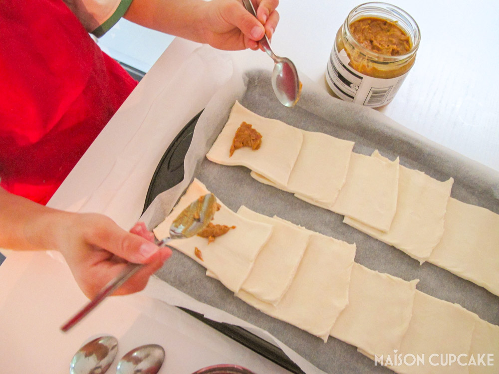 Peanut Butter Jelly Parcels with Puff Pastry - steps - spooning peanut butter filling