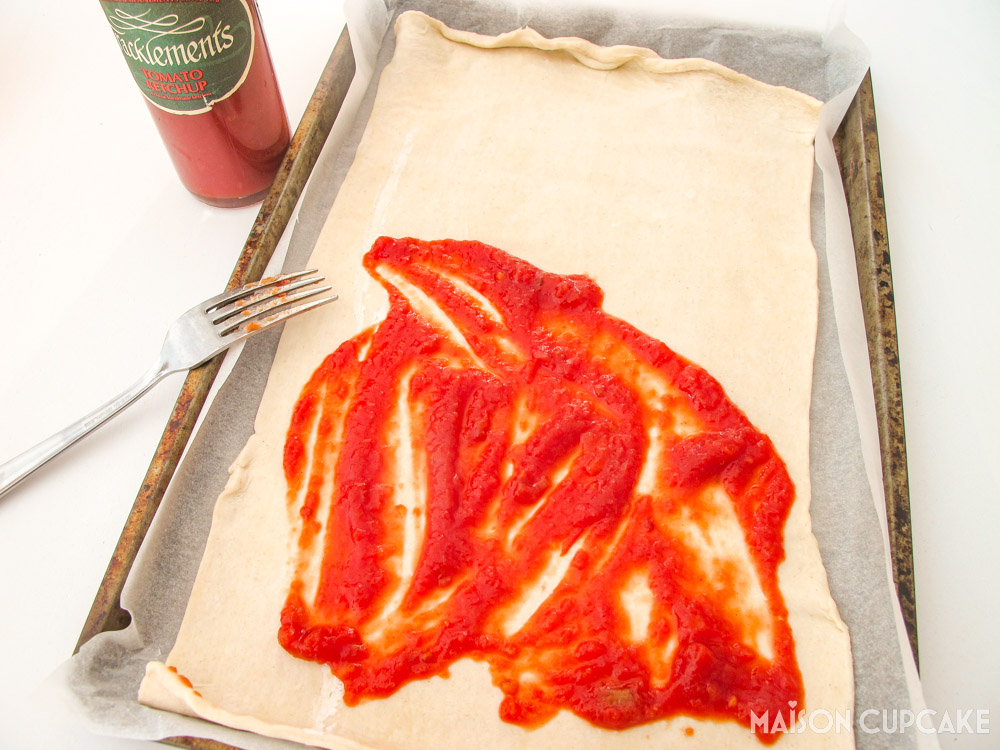 Tomato Olive Caper Tart - steps - spreading tomato paste on the pastry