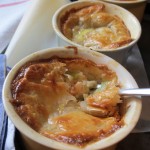 Mini chicken and leek pies topped with puff pastry served in ramekins