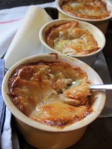 Mini chicken and leek pies topped with puff pastry served in ramekins