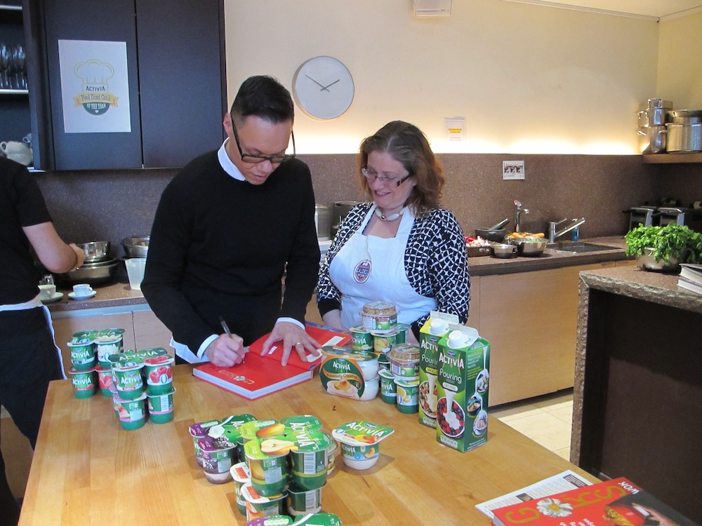 Gok Wan signs book for Sarah Trivuncic at Activia Feel Good Cook of The Year winners day