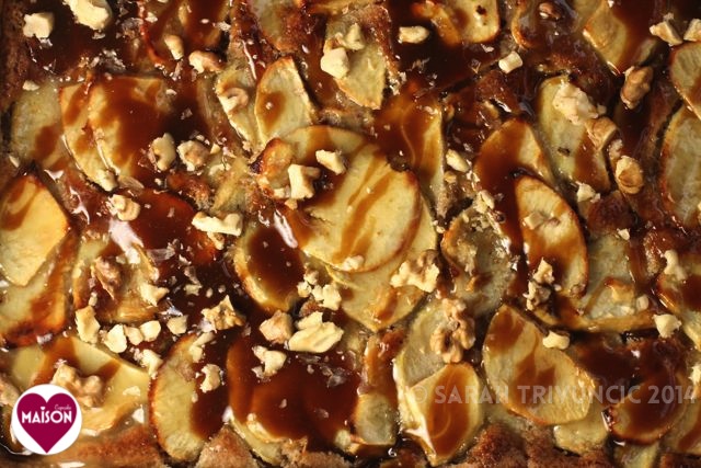 Close up of Toffee Apple Tart showing apple slices, toffee sauce, chopped nuts