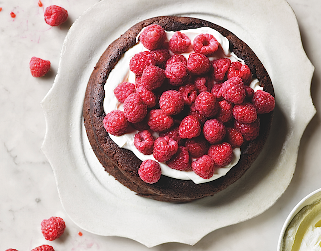 Joanne Harris Flourless Chocolate Cake covered in Raspberries