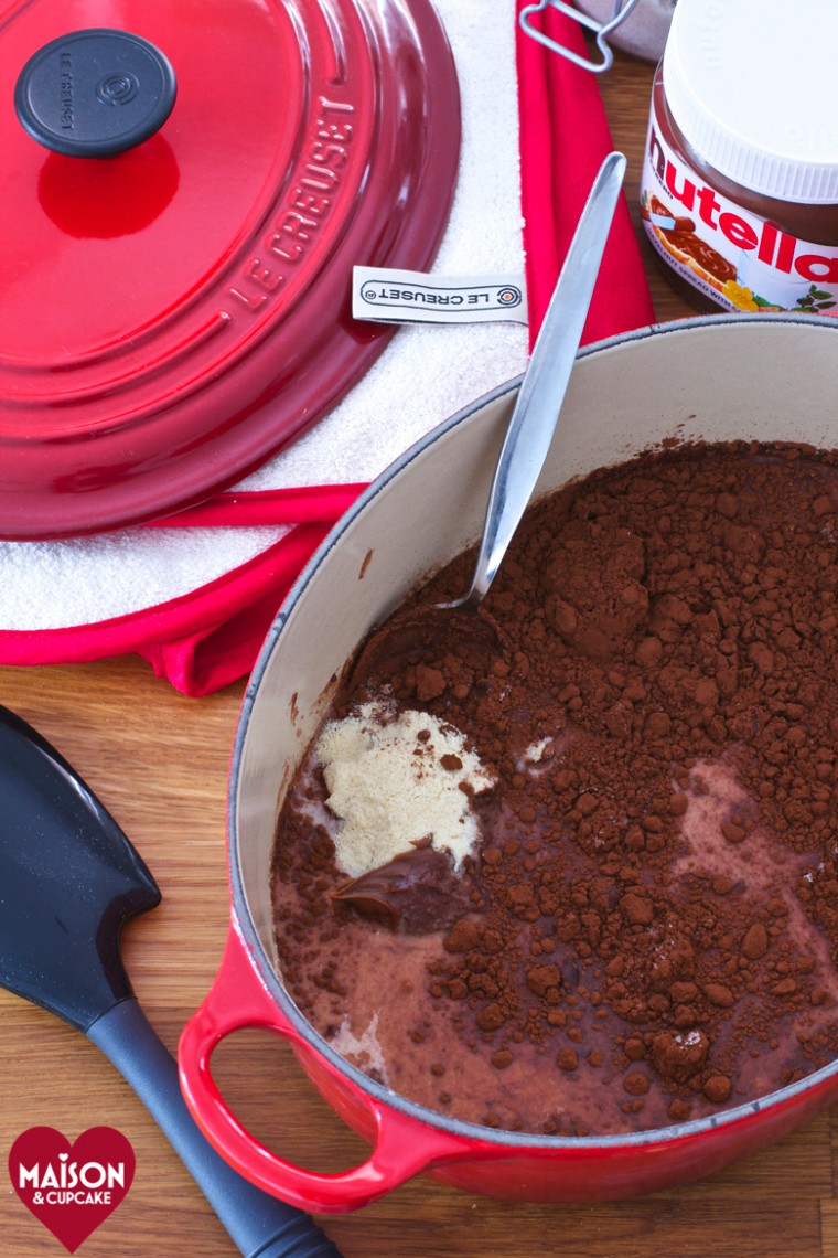 Steps to make Nutella chocolate semolina pudding; cocoa powder has been added to the mixture in a red casserole dish.