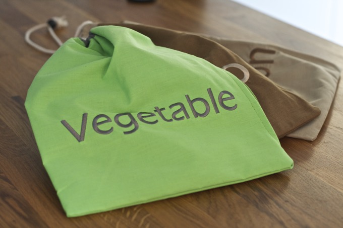 Lakeland Vegetable Storage Bags - green bag with slogan "vegetable", two brown bags lie underneath.