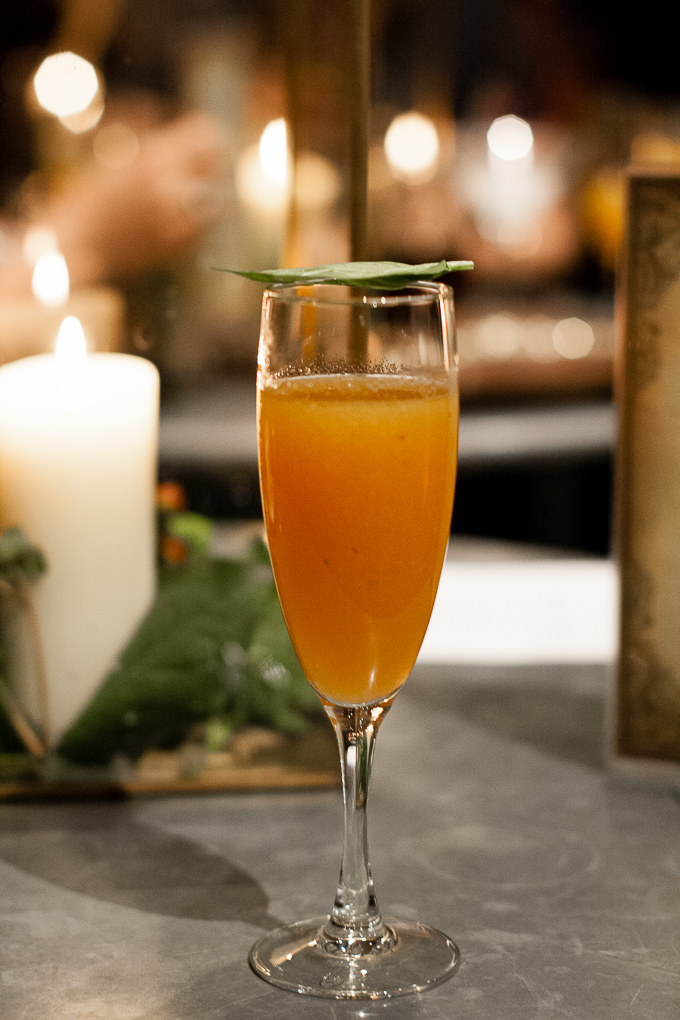 Flute glass with peach based cocktail, The Diamond (vodka, green tea, peach, basil), for Russell Hobbs 60th anniversary event