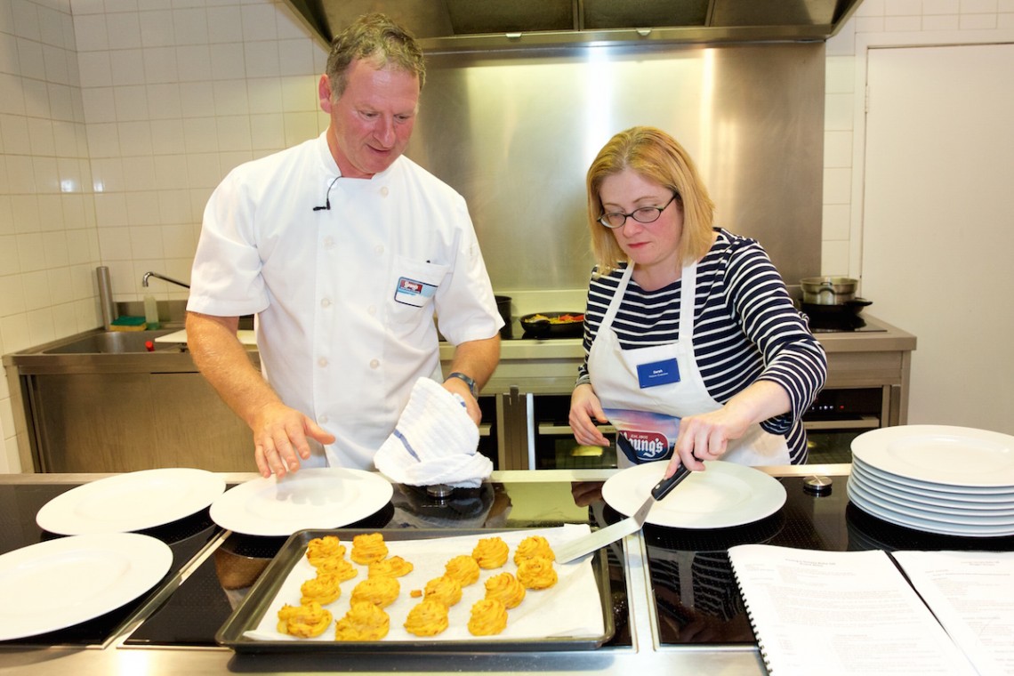 Chef Serge Nollent, left and Sarah Trivuncic, writer of Maison Cupcake, right. At L'Atelier des Chefs, Wigmore Street, Marylebone, taking part in the Blogger Bake Off with Youngs Seafood in 2016