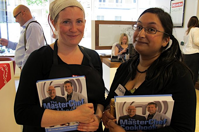 Two ladies holding Masterchef books with Gregg Wallace behind them