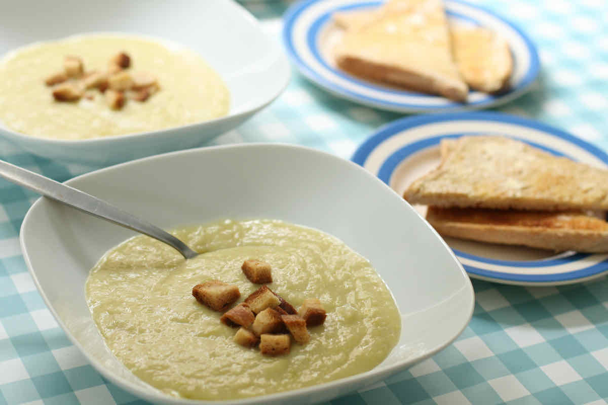 Easy Leek and Potato Soup served in bowls and topped with homemade croutons.