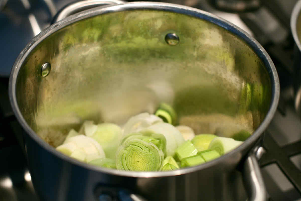 Softening leeks for leek and potato soup in a metal pan.
