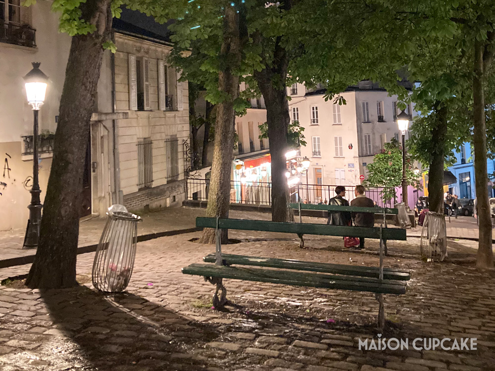 Montmartre by night with Parisian bench and lamps and cobbles