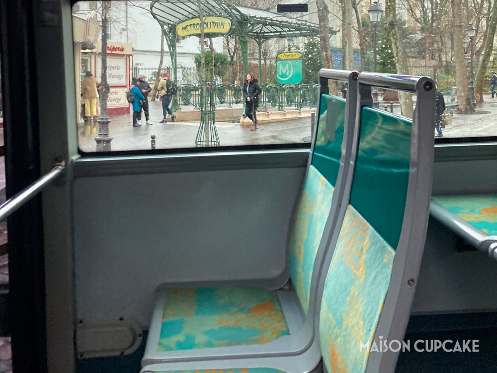 Paris bus interior with Art Nouveau metro entrance through window