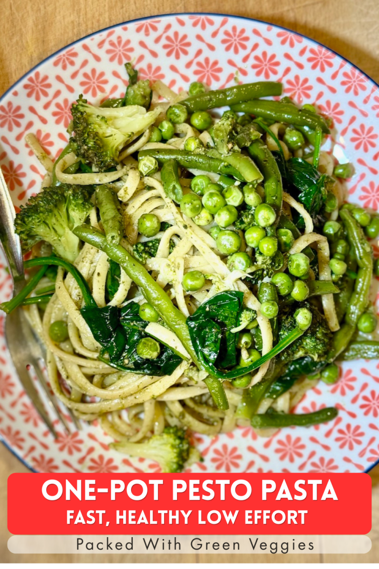 One-Pot Pesto Pasta with green veg, overhead photo of dish in red patterned bowl.
