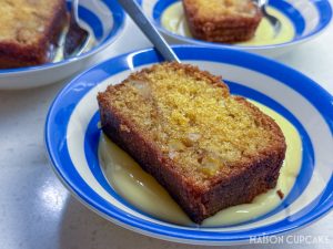 Apple Pound Cake with Pine Nuts in striped cornish blue bowls with custard