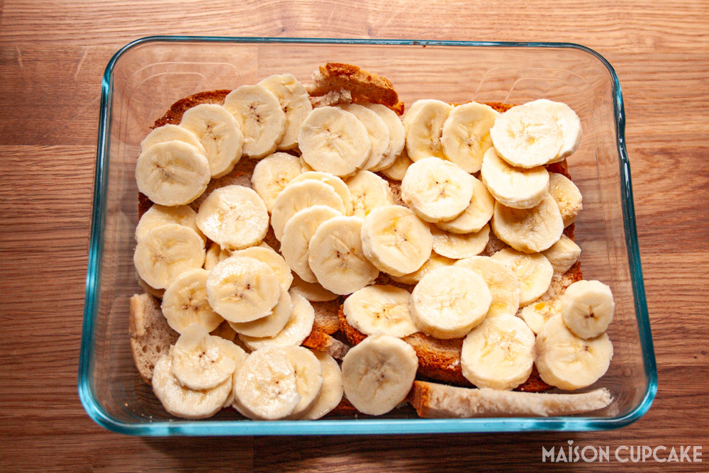 Steps making banoffee bread and butter pudding - layers of banana slices over bread in oven dish