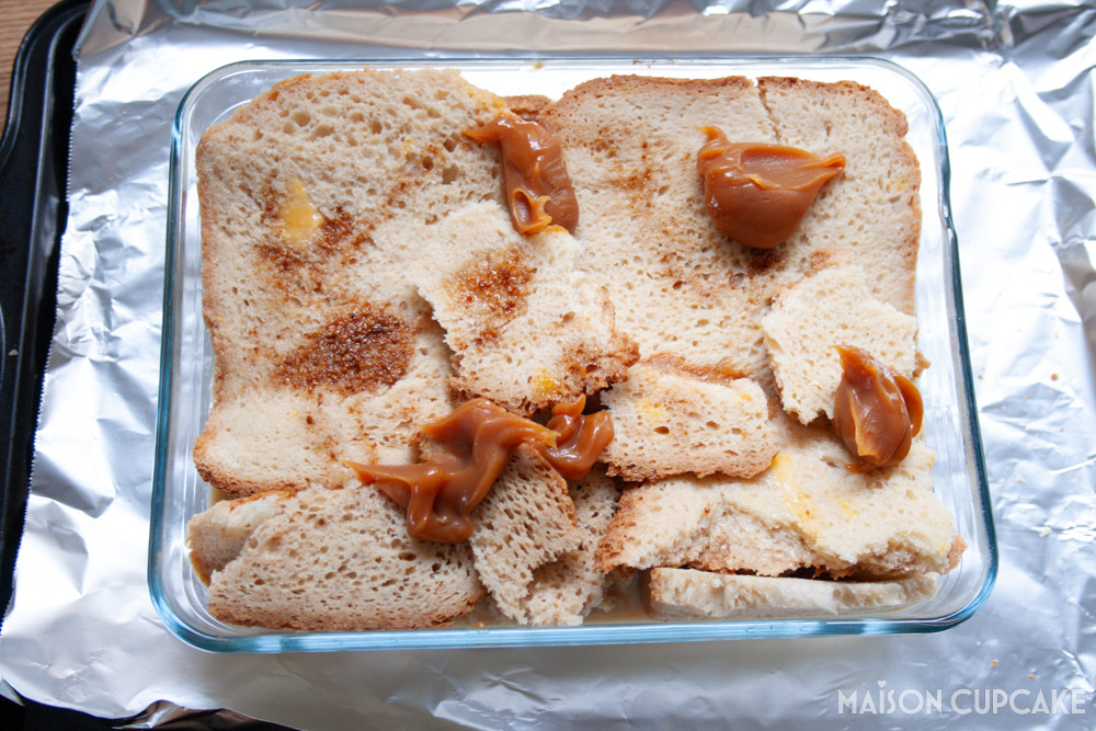 Steps making Banoffee Bread and Butter Pudding - spoonfuls of dulce de leche caramel on layers of bread