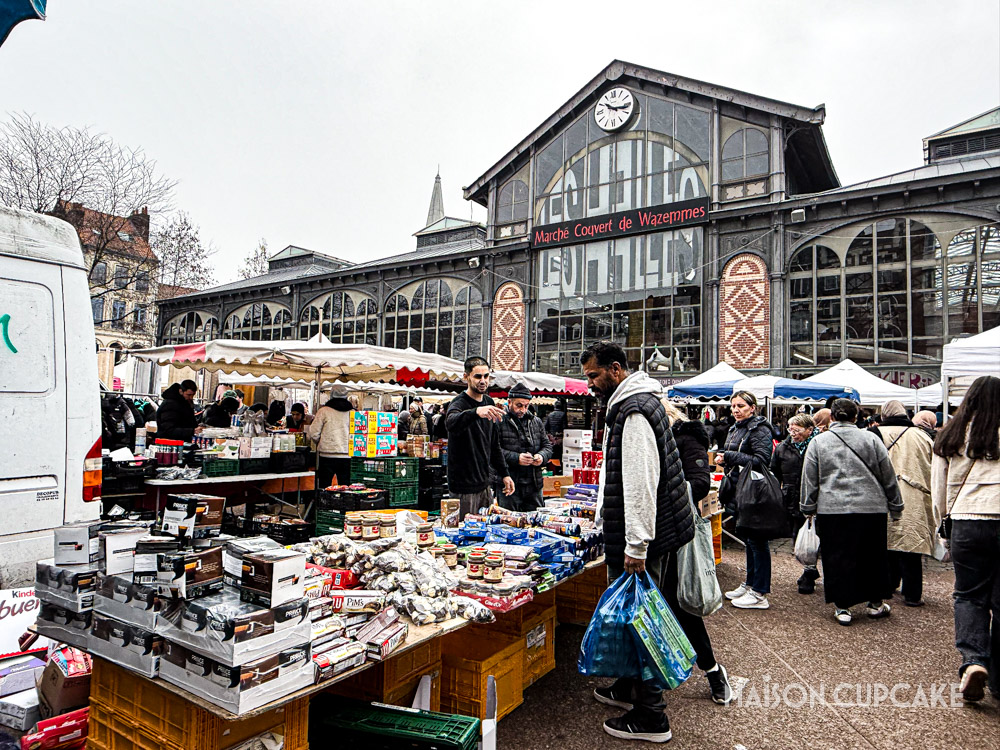 Shoppers browsing stalls at Wazemmes Sunday Market in Lille.
