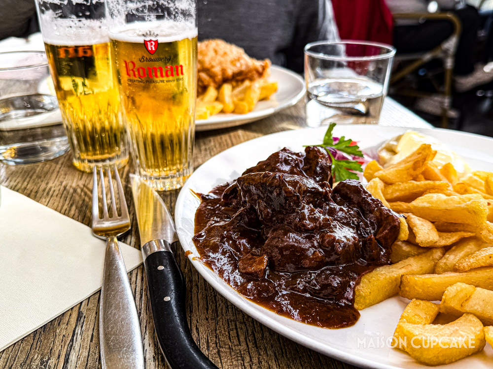 Traditional carbonnade flamande beef stew with frites and beer.
