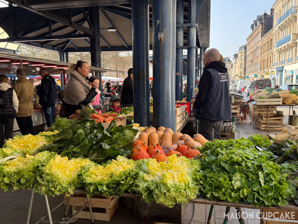 French market stall selling giant lettuce and vegetables in Rouen, Normandy.