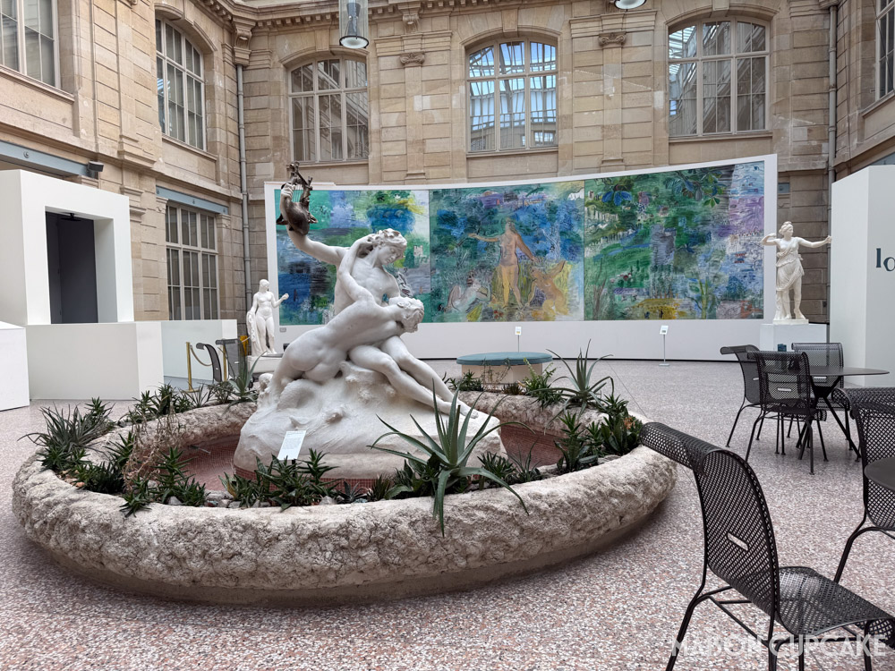 Atrium cafe space with Grecian sculpture fountain and Raoul Dufy murals in Musee des Beaux Arts Rouen.