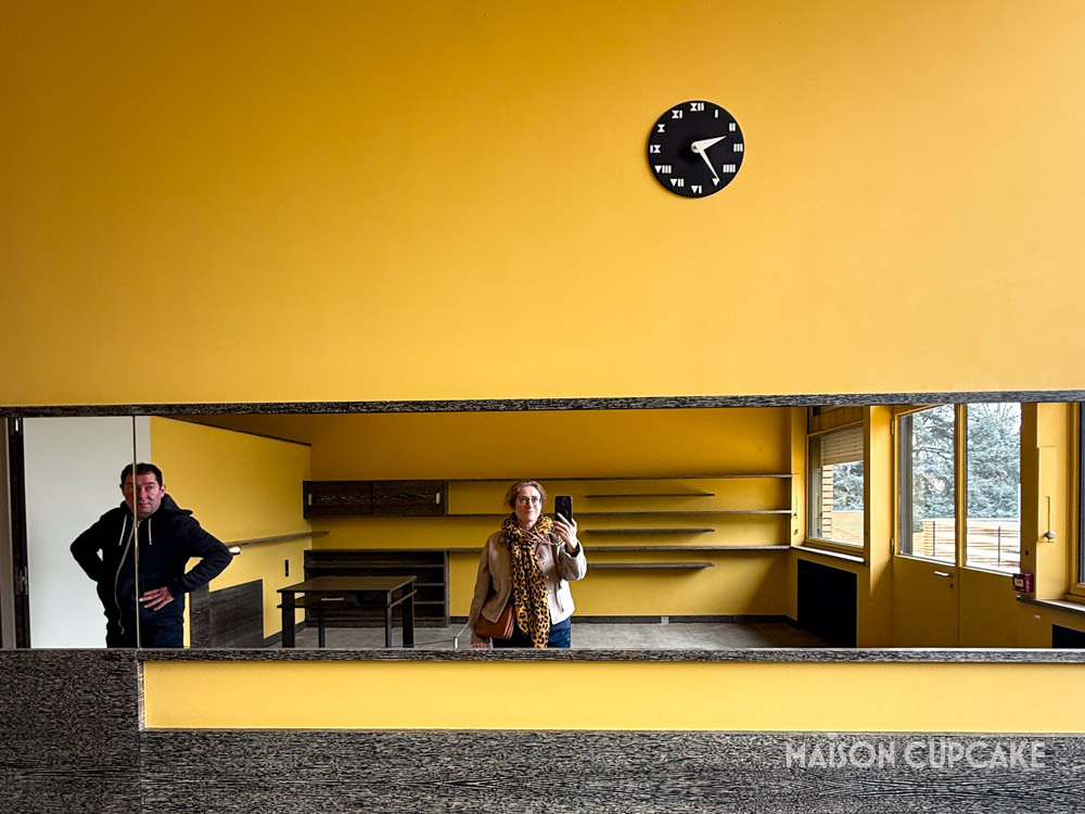 Visitors reflected in mirrored interior at Villa Cavrois