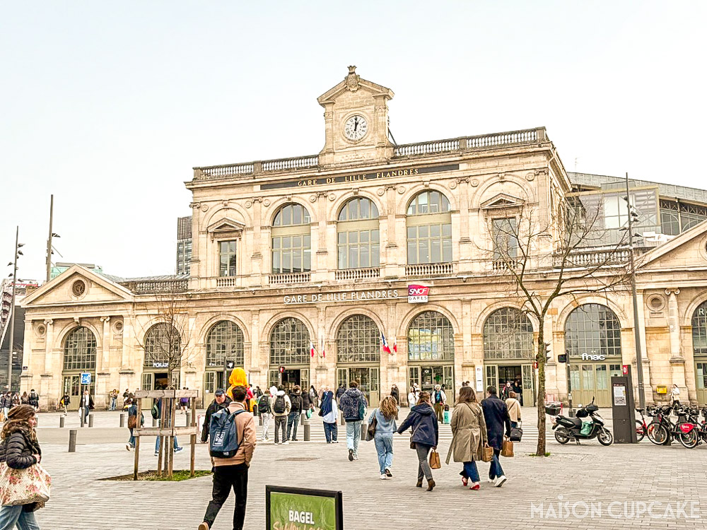 Lille Flanders SNCF station facade with pedestrians, France