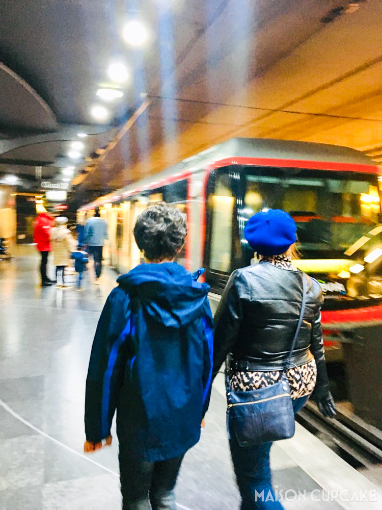 Lille metro platform with train and passengers