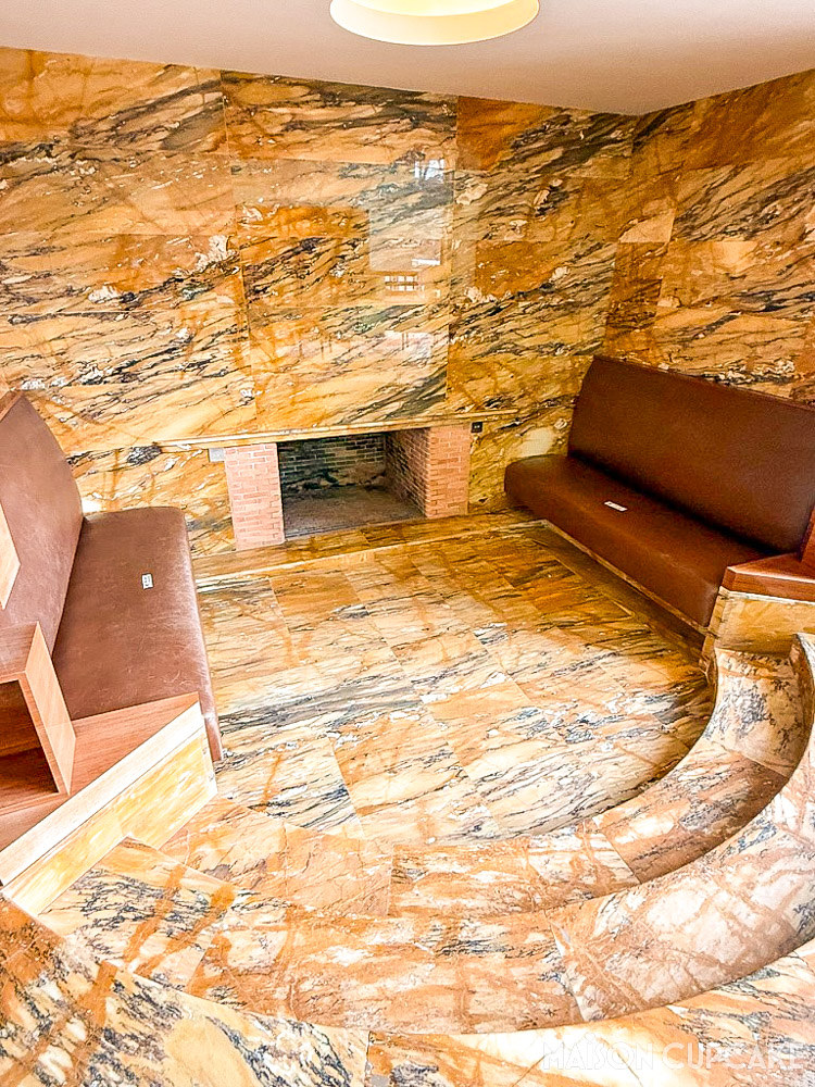 Warm toned marble conversation pit at Villa Cavrois with modernist lines and natural light
