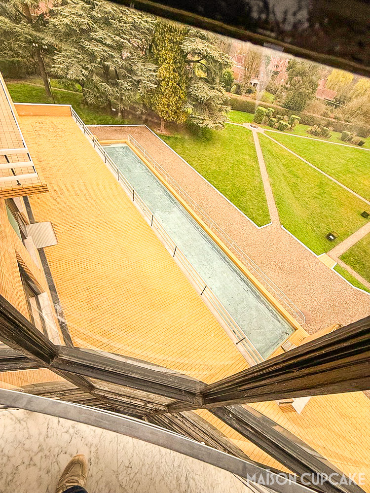 Roof terrace view from Villa Cavrois modernist house overlooking looking down at pool and gardens