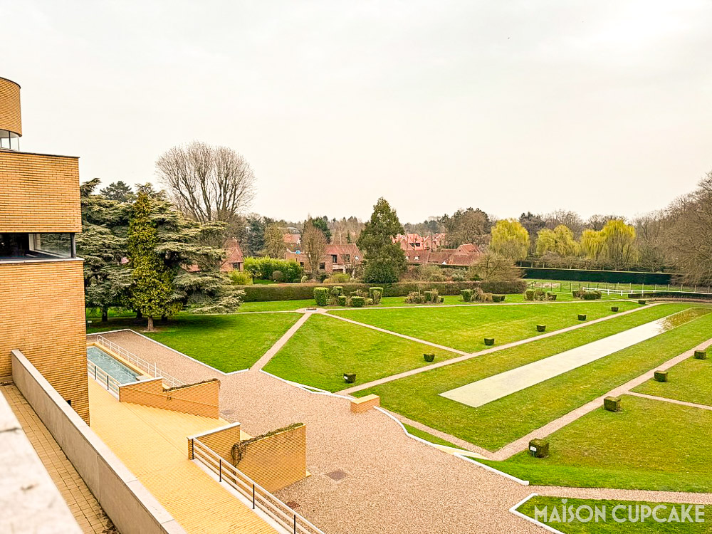 Exterior garden view as seen from roof terrace showing Villa Cavrois symmetry and open lawns