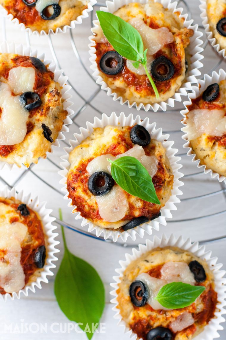 Overhead picture of pizza muffins topped with black olives and tomato sauce - Sarah Trivuncic Maison Cupcake